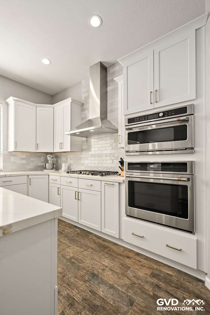 Modern kitchen in Roseville with Diamond cabinets, MSI countertops, stainless steel appliances, and gray subway tile