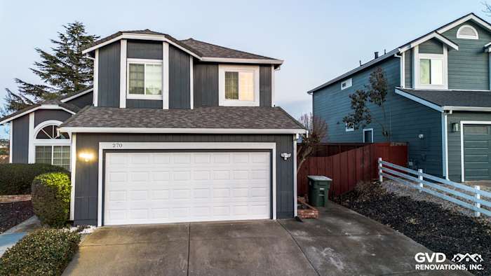 Modern home exterior in Vallejo featuring James Hardie Evening Blue Siding and Arctic White Trim with a garage
