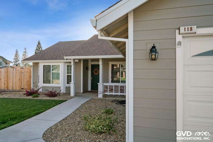 Exterior view of a home in Folsom with Monterey Taupe HardiePlank siding and Arctic White trim, landscaped entryway