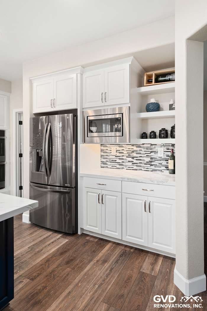 Modern kitchen remodel featuring white cabinetry, stainless steel appliances, and a stylish backsplash in El Dorado Hills