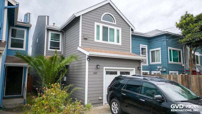Newly renovated Oakland home featuring Aged Pewter James Hardie siding and Arctic White trim, with Milgard windows