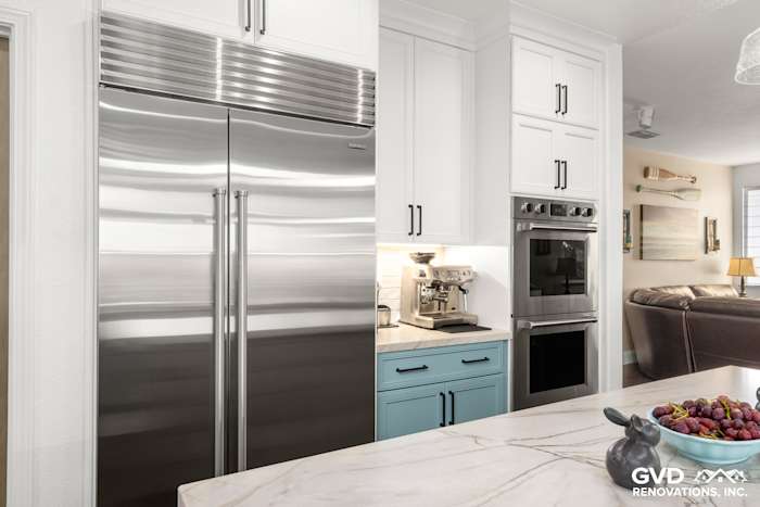 Modern kitchen with stainless steel appliances, quartzite countertops, and elegant cabinetry in Roseville, CA