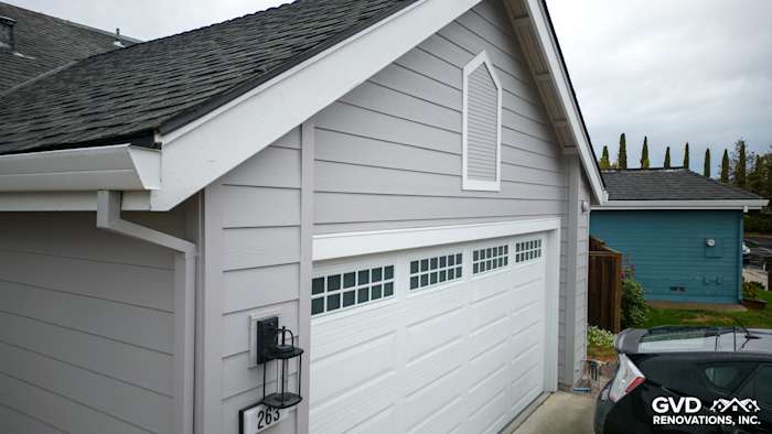 New Pearl Gray James Hardie siding and Milgard windows installed on home exterior in Foster City