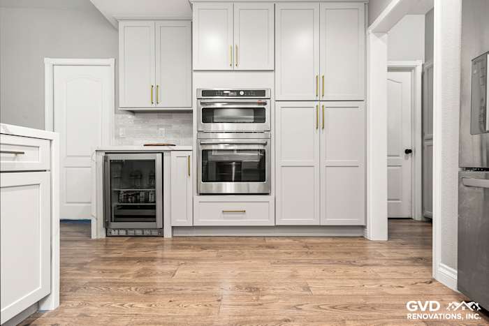 Modern kitchen remodel in El Dorado Hills featuring white custom cabinets, quartz countertops, and stainless steel appliances