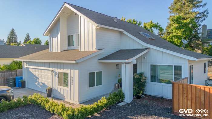 Home exterior showcasing James Hardie Lap & Batten Siding and Anlin Windows in Arctic White, enhancing curb appeal