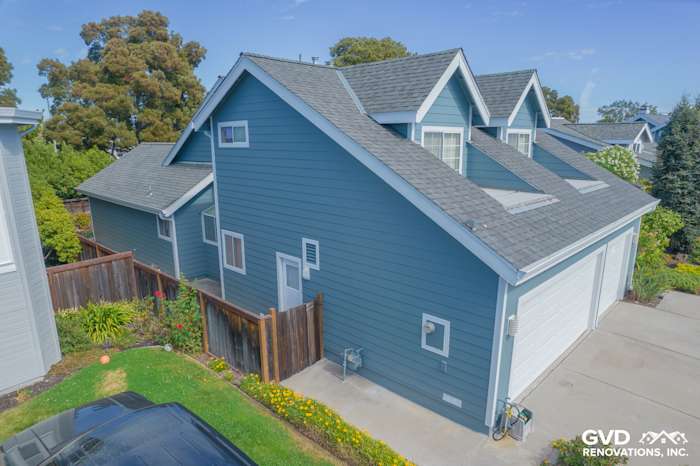 Foster City home with Boothbay Blue James Hardie siding and Arctic White trim, showcasing a modern exterior design