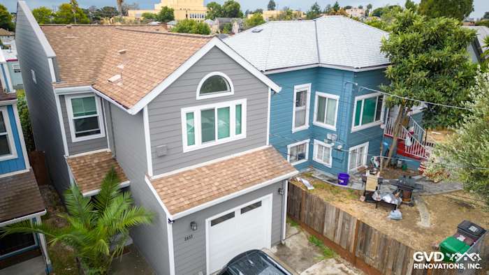 Oakland home featuring Aged Pewter James Hardie siding, Arctic White trim, and new roofing