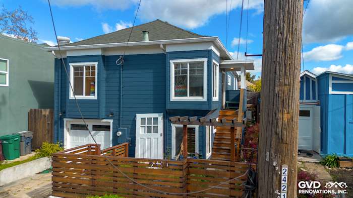 Home exterior featuring James Hardie Evening Blue siding and Arctic White trim in Oakland, CA