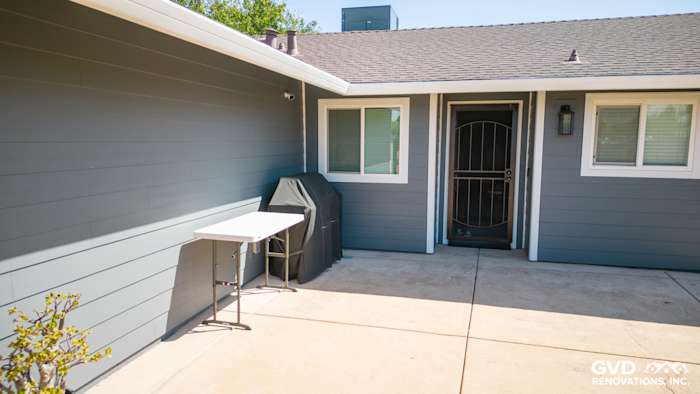 Night Gray James Hardie lap siding and Arctic White trim on a Sacramento home exterior patio area