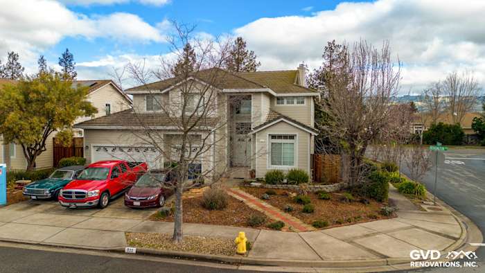 Two-story home in Petaluma with James Hardie Cobble Stone Lap Siding and Arctic White Trim, surrounded by landscaping