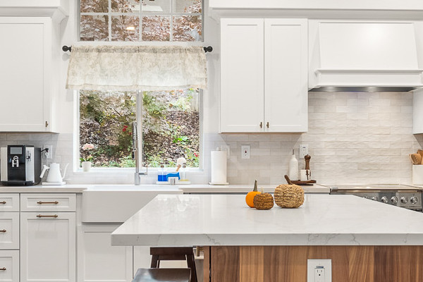 Modern Folsom kitchen remodel featuring Waypoint cabinets, Fieldstone island, and Custom Vadara Bronzo countertops