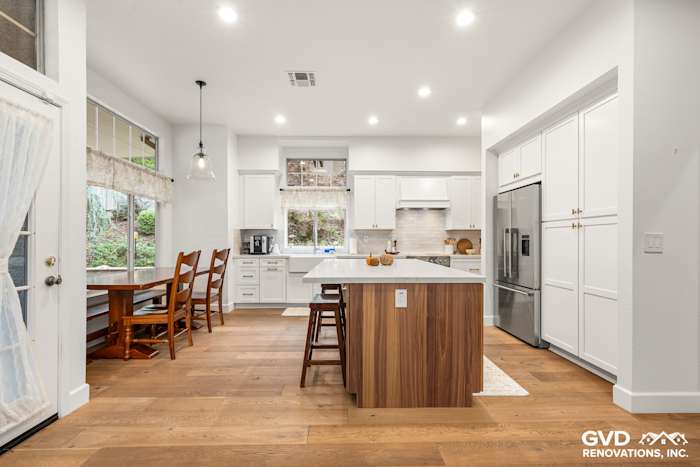 Modern Folsom kitchen remodel featuring Waypoint cabinets, Fieldstone island, and Custom Vadara Bronzo countertops