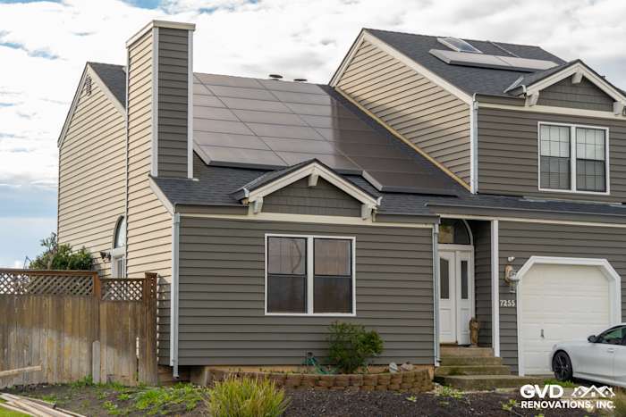 Modern home exterior featuring Prodigy Siding in gray, solar panels, and a welcoming entryway in Stockton, CA