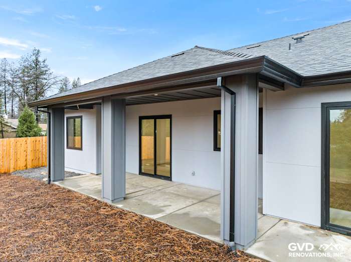 New construction home exterior in Paradise featuring James Hardie Architectural Panels and black Milgard Windows