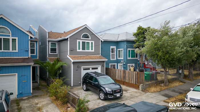 Updated Oakland home featuring Aged Pewter James Hardie siding, Arctic White trim, and a modern garage