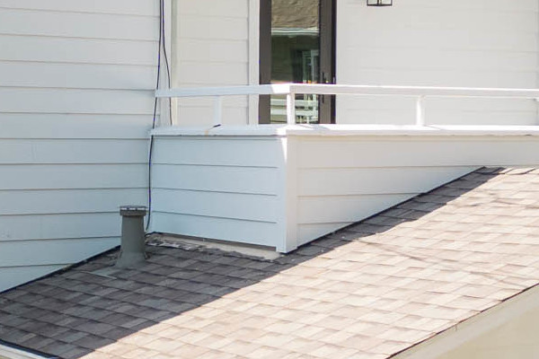 New Arctic White James Hardie siding on a modern home exterior in Orinda, CA with large windows and trimmed garden