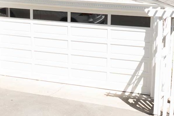 Driveway view of home featuring new Pearl Gray James Hardie shingle siding and white trim in Orinda, CA