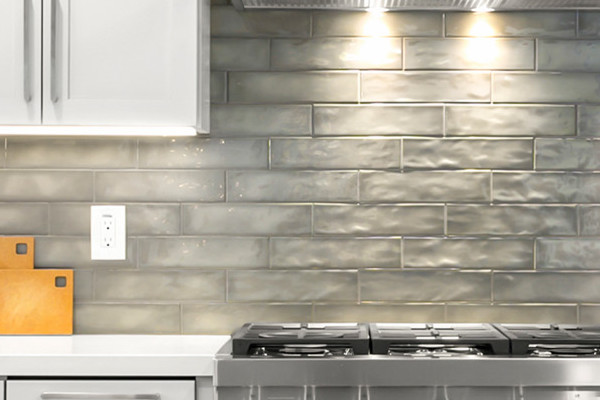 Modern kitchen remodel featuring gray cabinets, stainless steel appliances, and neutral backsplash in Rocklin, CA