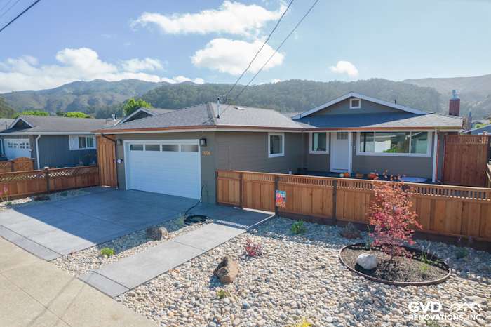 Home exterior in Pacifica featuring James Hardie Timber Bark siding, Arctic White trim, and Anlin windows, with gravel