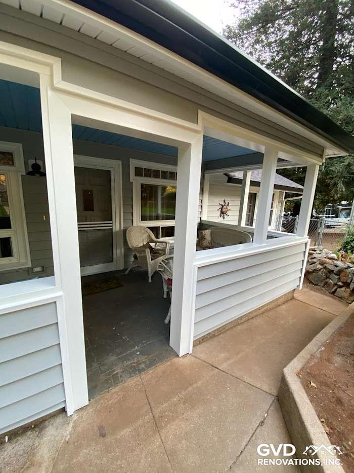 Transformed home exterior featuring Prodigy Vinyl Siding in soft gray, with a welcoming porch area in Grass Valley