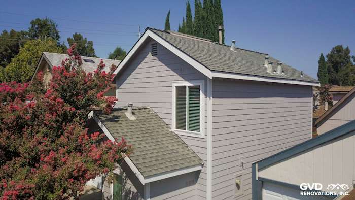 Pearl Gray HardiePlank Lap Siding with Arctic White HardieTrim Boards on a Davis home exterior