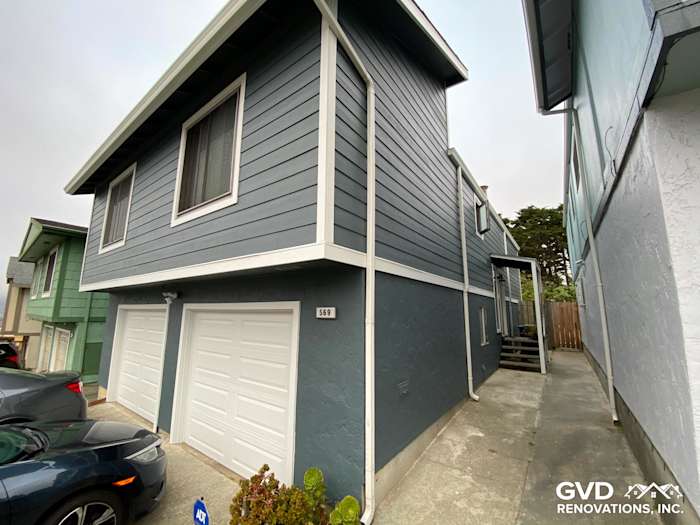 Newly installed James Hardie siding in blue and gray colors on a Daly City home exterior