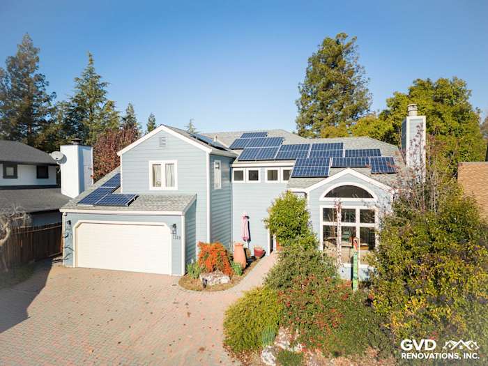 Davis home featuring newly installed Boothbay Blue James Hardie siding and solar panels on the roof