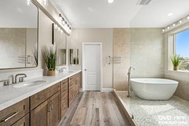 Spacious master bathroom in El Dorado Hills featuring a freestanding tub, double vanity, and modern shower