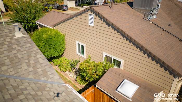 Aerial view of Sacramento home featuring new Khaki Brown James Hardie siding and well-maintained landscaping