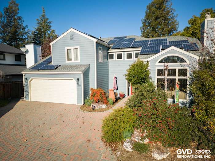Boothbay Blue James Hardie siding on modern home in Davis, CA with solar panels and paver driveway