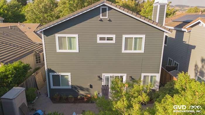 Petaluma home featuring James Hardie Iron Gray siding, Arctic White trim, and new Anlin windows