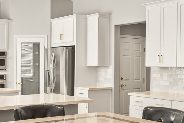 Modern Roseville kitchen featuring Diamond cabinets, MSI countertops, full-height backsplash, and a dining table