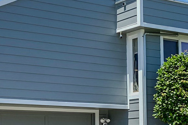 Gray Slate James Hardie lap siding with Arctic White trim on a Millbrae, CA home exterior