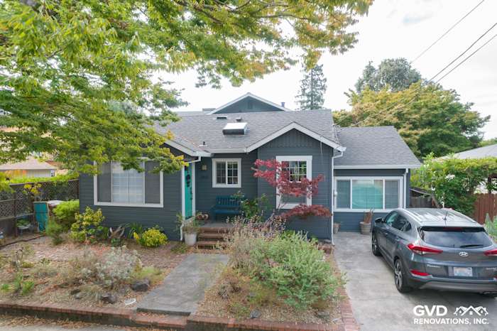 Newly installed James Hardie Lap siding in dark blue with a landscaped front yard in Napa, CA