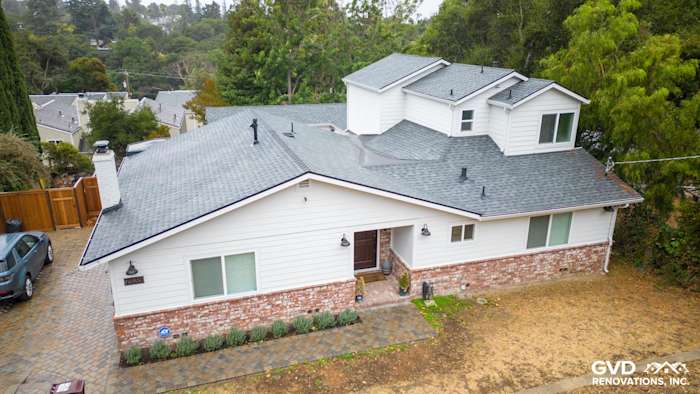 Updated Oakland home featuring James Hardie Cedarmill siding, Alside windows, and a modern design with stone accents