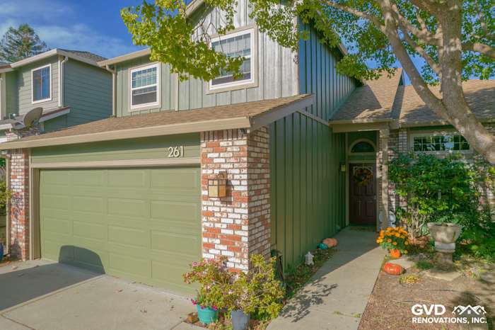 Home exterior featuring James Hardie siding in Mountain Sage color, brick accents, and landscaped entry in Vallejo, CA