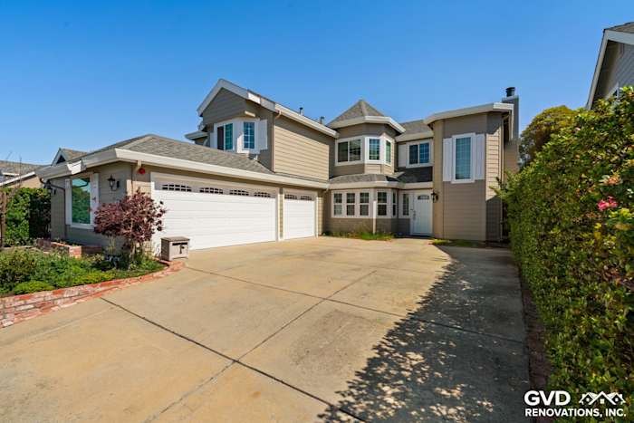 Residential exterior featuring Monterey Taupe James Hardie lap siding and Arctic White trim in Foster City, CA