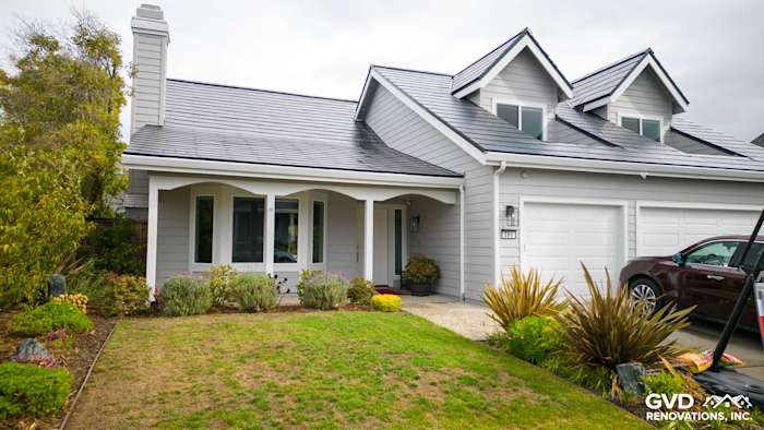 Foster City home exterior featuring Pearl Gray James Hardie siding and Arctic White trim with landscaped yard