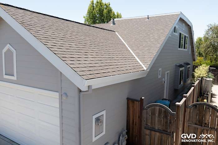 New James Hardie Plank Lap Siding in Pearl Gray with Arctic White HardieTrim on a home exterior in Foster City
