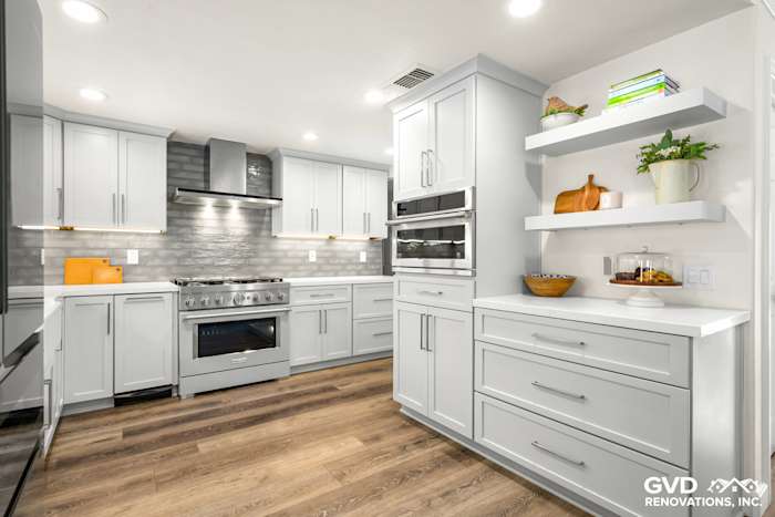 Modern Rocklin kitchen remodel featuring gray cabinets, stainless steel appliances, and stylish quartz countertops