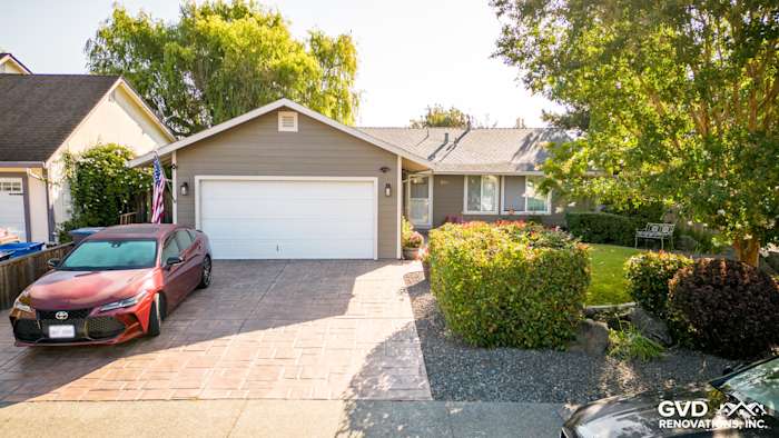 Home exterior in Rohnert Park featuring Timber Bark HardiePlank siding and Cobble Stone trim, landscaped driveway