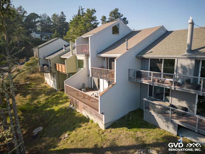 Pearl Gray James Hardie lap siding installed on a unique Mill Valley home with wooden balconies