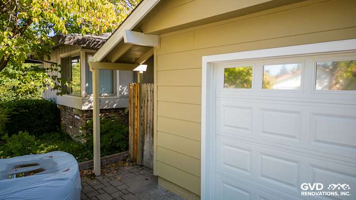 Newly installed James Hardie HardiePlank Lap Siding in a warm yellow color on a home exterior