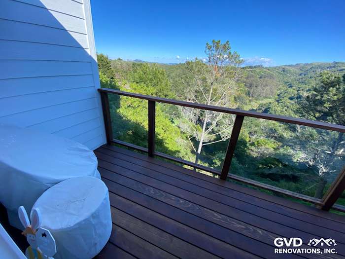 Covered deck featuring new wooden flooring and railing, overlooking a scenic view in Mill Valley, CA