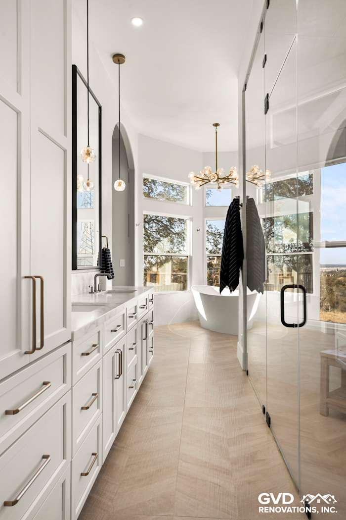 Luxurious El Dorado Hills bathroom with custom cabinets, freestanding tub, and glass-enclosed steam shower