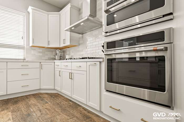 Modern kitchen in Roseville, CA with Diamond cabinets, MSI countertops, stainless steel appliances, and herringbone