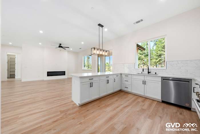 Bright custom kitchen in Paradise, CA featuring white cabinetry, quartz countertops, and large windows for natural light