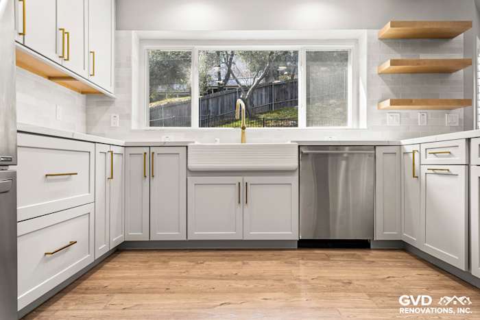 Spacious modern kitchen in El Dorado Hills with custom gray cabinets, quartz countertops, and a farmhouse sink