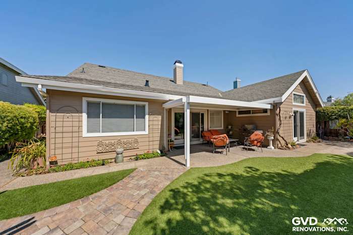 Home exterior featuring Khaki Brown HardiePlank siding, Arctic White trim, and a landscaped patio in Foster City