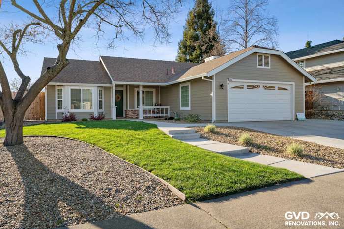 Monterey Taupe James Hardie siding and Arctic White trim on renovated Folsom home exterior with landscaped yard